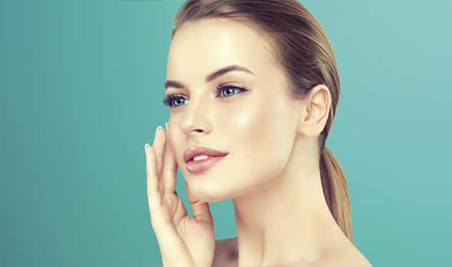 Morpheus8 skin remodelling Dublin - woman in profile touching her cheek with one hand Woman in profile touching her cheek with one hand against a teal background for Morpheus8 skin remodelling in Dublin